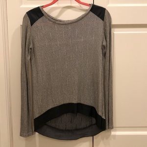 Gray and gold sweater with black leather accents